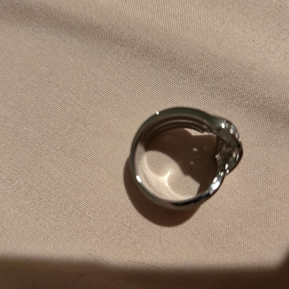 Silver and White Twisting Diamond Ring